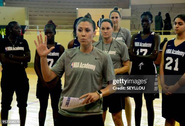 Coaches Blair Hardiek speaks watched by fellow coach Jennifer Azzi and players Senegal's Mame D.C. Thiaw and Egypt's Jana H.Abdullah as they take...