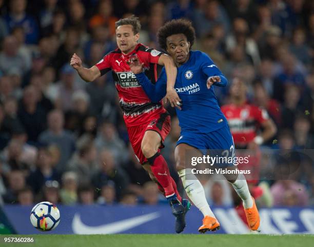 Willian of Chelsea and Chris Löwe of Huddersfield during the Premier League match between Chelsea and Huddersfield at Stamford Bridge on May 9, 2018...