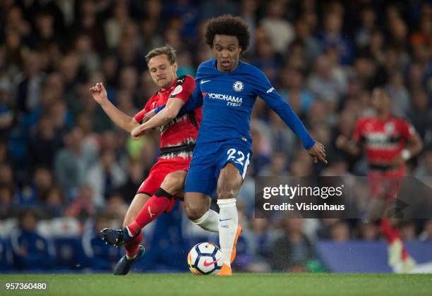Willian of Chelsea and Chris Löwe of Huddersfield during the Premier League match between Chelsea and Huddersfield at Stamford Bridge on May 9, 2018...