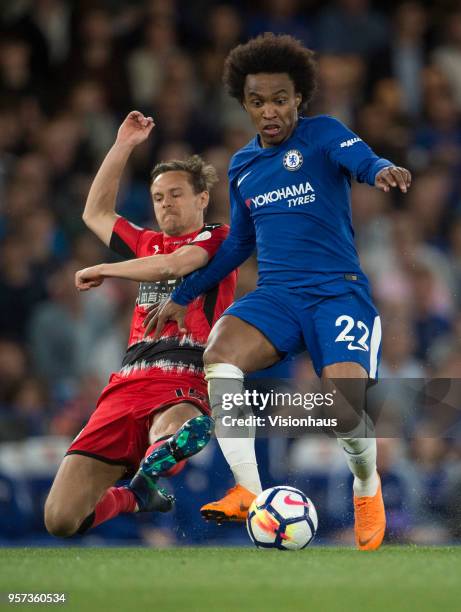 Willian of Chelsea and Chris Löwe of Huddersfield during the Premier League match between Chelsea and Huddersfield at Stamford Bridge on May 9, 2018...