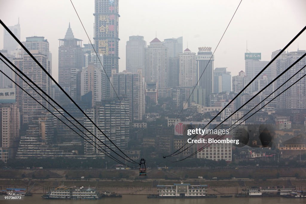 Commuters take a cable car across the Yangtze river in Chong