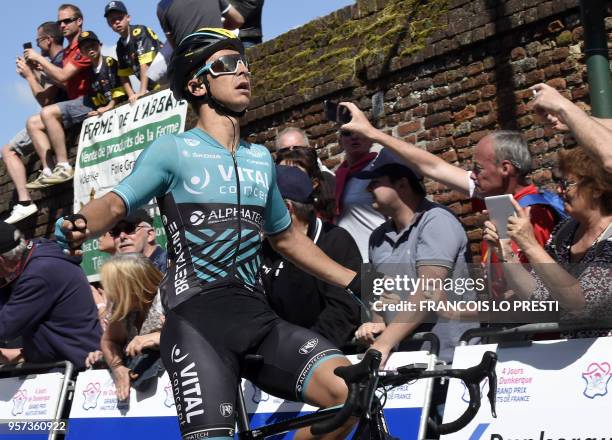 France's Bryan Coquard celebrates as he crosses the finish line to win the fourth stage of the Four days of Dunkirk cycling race, on May 11, 2018 in...