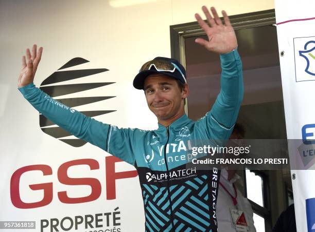 France's Bryan Coquard celebrates during the podium ceremony for the fourth stage of the Four days of Dunkirk cycling race, on May 11, 2018 in...