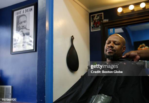 Harris gets his hair cut inside In Style Barber Shop along Cambridge Street in East Cambridge, MA on May 10, 2018. A walk along Cambridge Street in...