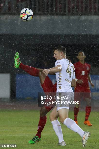 Jack Raymond Clarke of Leeds United vies for the ball with Htike Aung of Myanmar national team during a friendly match at Mandalar Thiri stadium in...