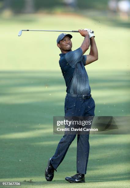 Tiger Woods of the United States plays his second shot on the par 4, 10th hole during the second round of the THE PLAYERS Championship on the Stadium...
