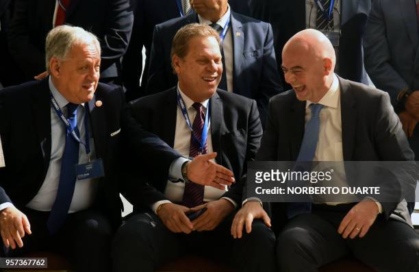 Chilean Football Association President Arturo Sala, Colombian Football Association President Ramon Jesurun and FIFA President Gianni Infantino, share...