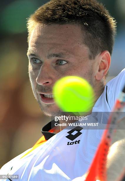 Robin Soldering of Sweden hits a backhand return during his loss to Jo-Wilfried Tsonga of France at the Kooyong Classic tennis tournament, in...