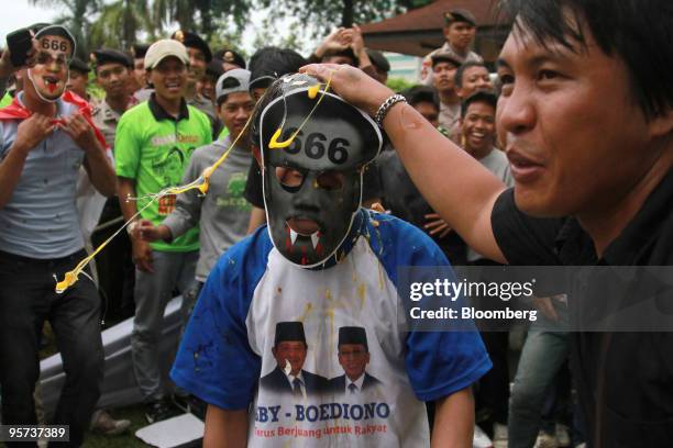 Protest takes place outside the parliamentary building as Indonesia's Finance Minister Sri Mulyani Indrawati, not pictured, speaks in front of a...