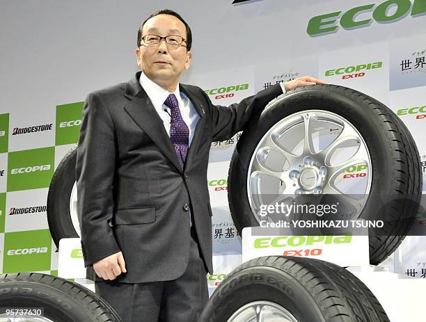 Japan's tire giant Bridgestone president Shoshi Arakawa introduces the new eco-friendly tires "Ecopia EX10" at a Tokyo hotel on January 13, 2010. The...
