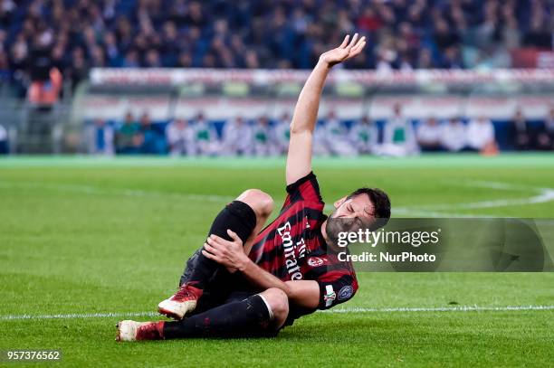 Hakan Calhanoglu of Milan lies injured during the TIM Cup - Coppa Italia final match between Juventus and AC Milan at Stadio Olimpico, Rome, Italy on...