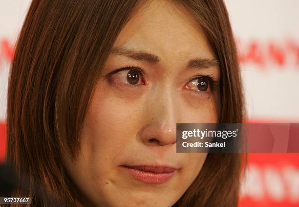 Badminton player Kumiko Ogura sheds tears during her retirement press conference at Daito Sports Center on January 12, 2010 in Daito, Osaka, Japan.