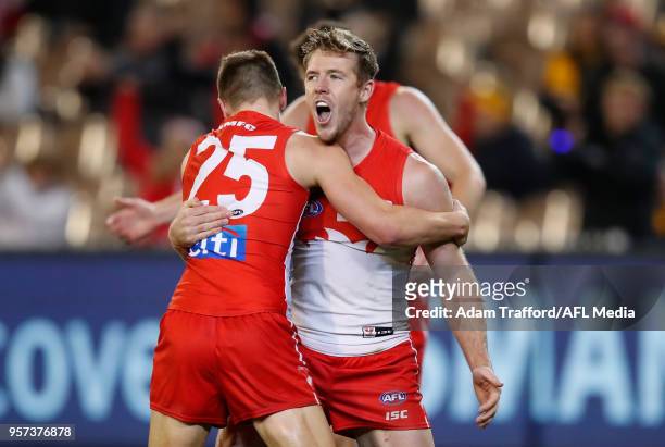 Ben Ronke of the Swans celebrates his sixth goal with Luke Parker of the Swans during the 2018 AFL round eight match between the Hawthorn Hawks and...