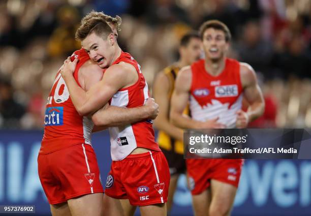 Ben Ronke of the Swans celebrates his sixth goal with Luke Parker of the Swans during the 2018 AFL round eight match between the Hawthorn Hawks and...