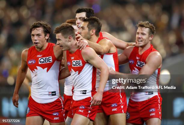 Ben Ronke of the Swans celebrates his fifth goal with teammates during the 2018 AFL round eight match between the Hawthorn Hawks and the Sydney Swans...