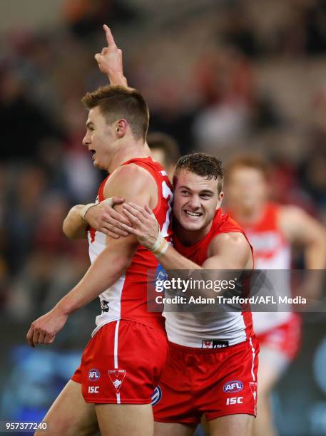 Tom Papley of the Swans congratulates youngster Ben Ronke of the Swans on his fifth goal during the 2018 AFL round eight match between the Hawthorn...