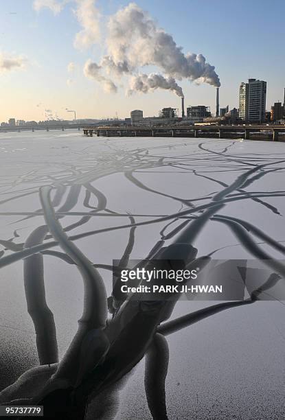 Bitter cold forms a weird ice pattern in the Han river which runs across South Korea's capital in Seoul on January 13, 2010. A cold spell sent...