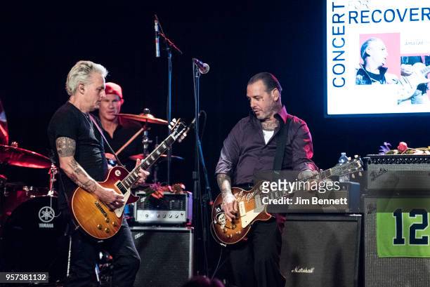 Guitarist Mike McCready , drummer Chad Smith and guitarist and singer Mike ness perform live on stage during the MusiCares Concert for Recovery...