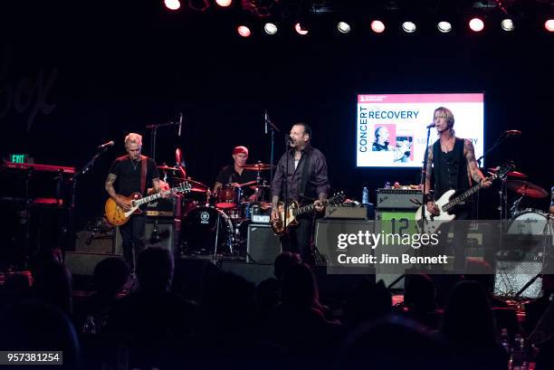 Guitarist Mike McCready , drummer Chad Smith, guitarist and singer Mike Ness and bassist Duff McKagan perform live on stage during the MusiCares...