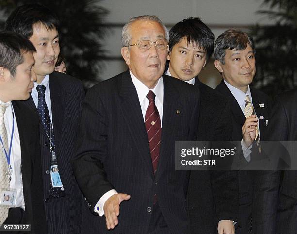 Kazuo Inamori , the founder of Japanese high-tech maker Kyocera, is surrounded by reporters upon his arrival at the prime minister's official...