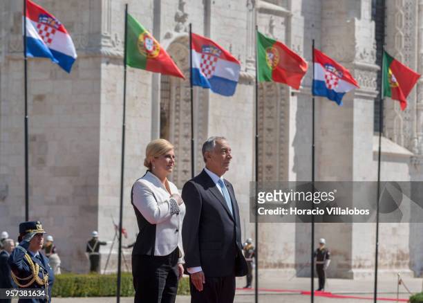 Portuguese President Marcelo Rebelo de Sousa and the President of Croatia Kolinda Grabar-Kitarovic listen to national anthems outside Jeronimos...