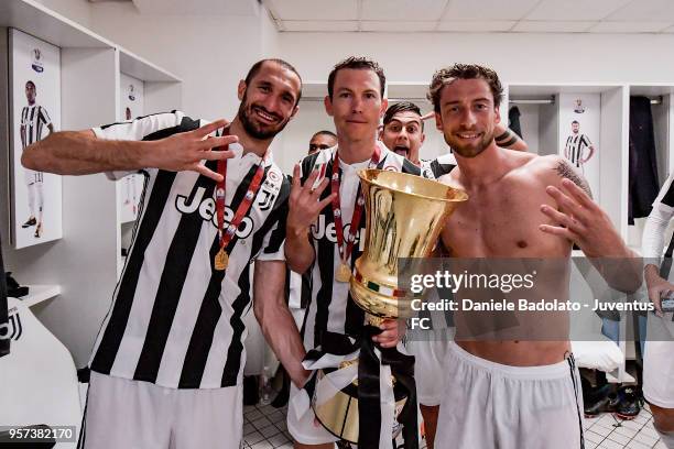 Giorgio Chiellini , Stephan Lichtsteiner and Claudio Marchisio of Juventus in action during the TIM Cup Final between Juventus and AC Milan at Stadio...