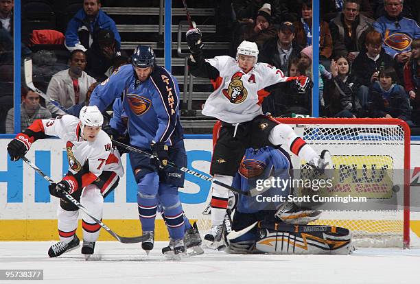 Chris Kelly and Jarkko Ruutu of the Ottawa Senators screen a shot against Boris Valabik and Ondrej Pavelec of the Atlanta Thrashers at Philips Arena...