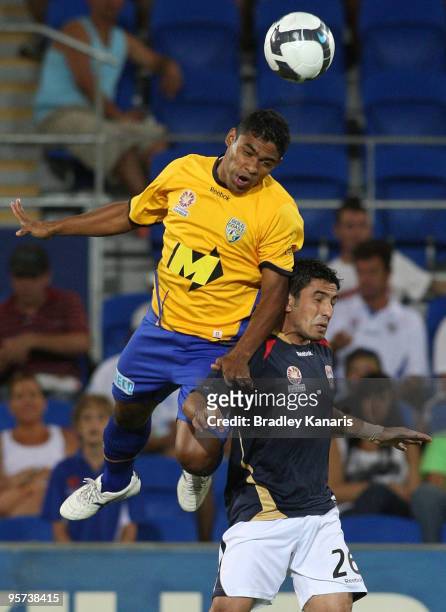 Anderson of the Gold Coast gets above Ali Abbas of the Jets as they challenge for the ball during the round 19 A-League match between Gold Coast...
