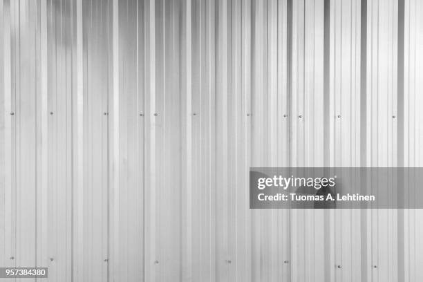 full frame background of shiny corrugated galvanized metal wall texture in black and white - 波形鉄板 ストックフォトと画像