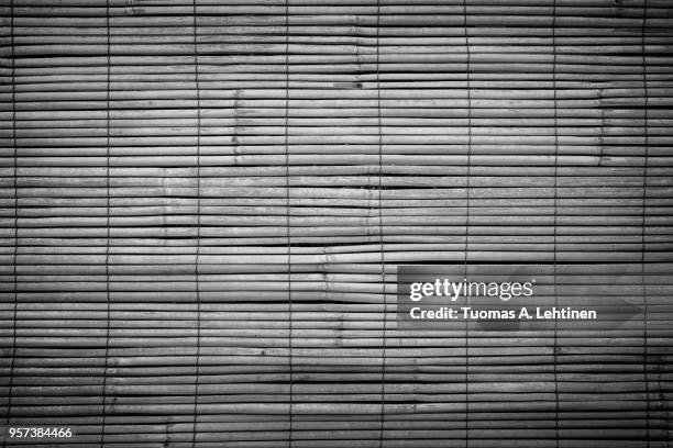 full frame background of aged wooden bamboo blinds in black and white with vignette. they are popular in asia. - black bamboo stock pictures, royalty-free photos & images