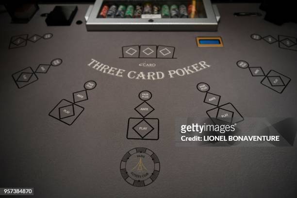 Three card poker table is pictured at the "Paris Elysees Club", the first "gaming club" to open its doors in the French capital in Paris, on May 9,...