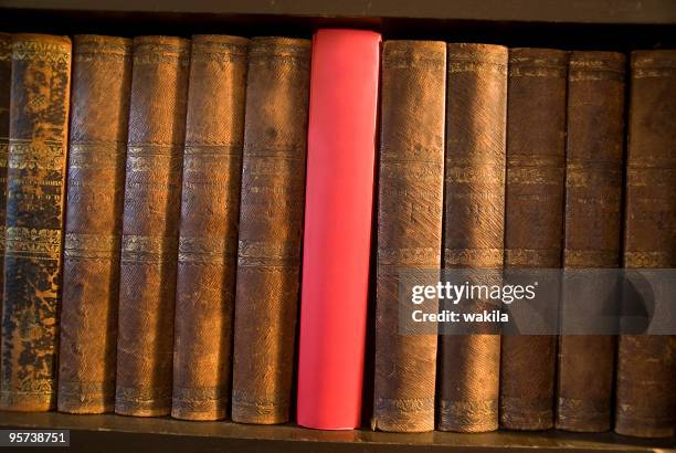 innovation books with one new red - literature rack stock pictures, royalty-free photos & images