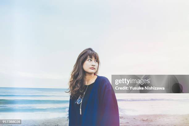 a young  woman looking at one point - teenager staring imagens e fotografias de stock