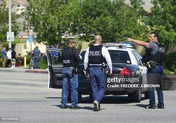 Police man an intersection May 11, 2018 following reports of shooting at Highland High School in Palmdale, 40 miles north of downtown Los Angeles. -...