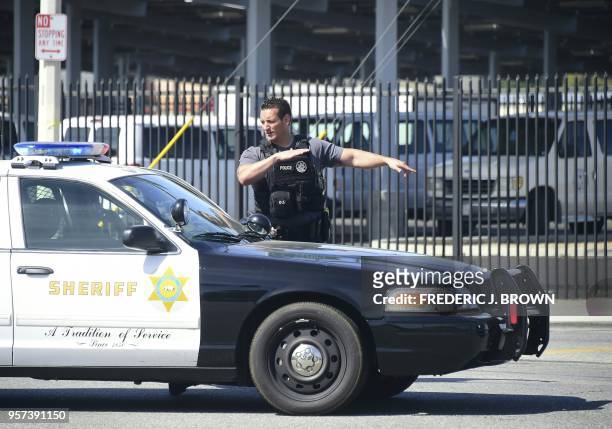 Police man an intersection May 11, 2018 following reports of shooting at Highland High School in Palmdale, 40 miles north of downtown Los Angeles. -...