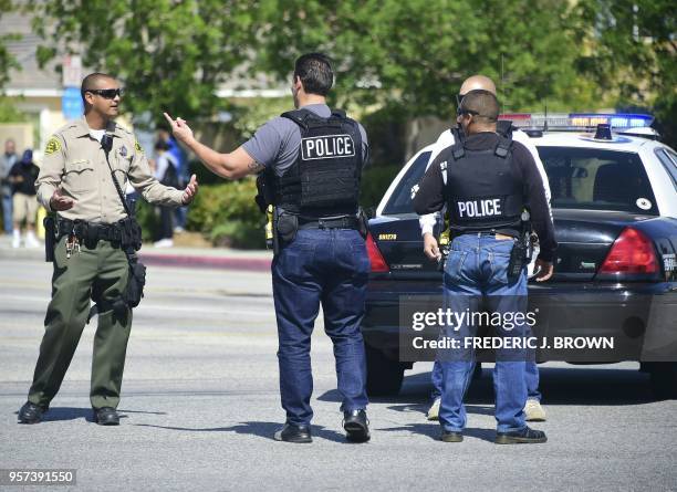 Police man an intersection May 11, 2018 following reports of shooting at Highland High School in Palmdale, 40 miles north of downtown Los Angeles. -...