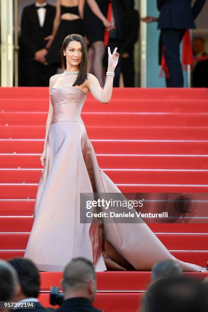Model Bella Hadid makes a peace sign as she attends the screening