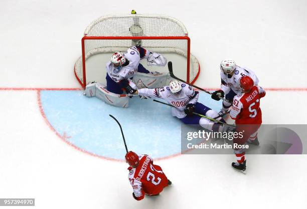 Oliver Bjorkstrand of Denmark fails to socre over Henrik Haukeland, goaltender of Norway during the 2018 IIHF Ice Hockey World Championship Group B...