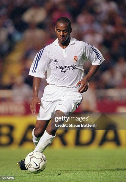 Flavio Conceicao of Real Madrid runs with the ball during the Teresa Herrera tournament match against Deportivo La Coruna played at the Estadio...