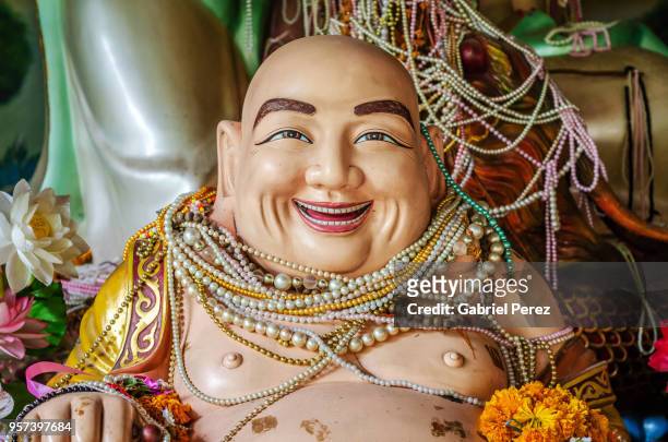 budai: the laughing chinese monk of chiang mai, thailand - shichi fukujin stockfoto's en -beelden