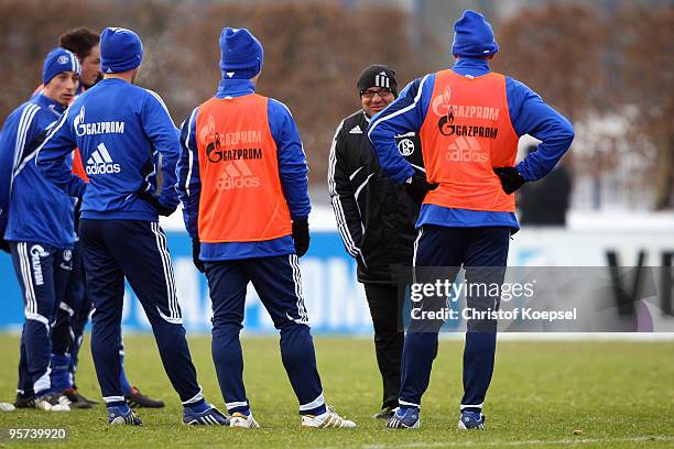 Head coach Felix Magath of Schalke talks to his team during the training session of FC Schalke at the training ground of the Veltins Arena on January...