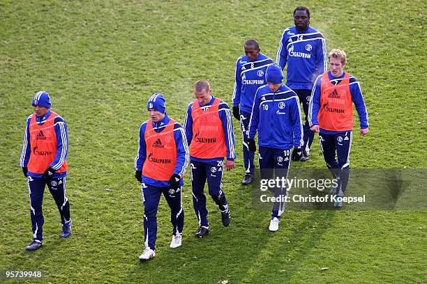 Rafinha, Alexander Baumjohann, Peer Kluge, Ivan Rakitic, Mineiro, Gerald Asamoah and Lewis Holtby attend the training session of FC Schalke at the...