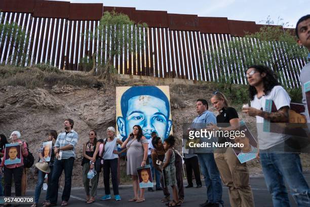 Demonstrators gather in Nogales, Sonora, Mexico at a vigil on May 10, 2018 for Jose Antonio Elena Rodriguez, the Mexican teenager who was shot and...