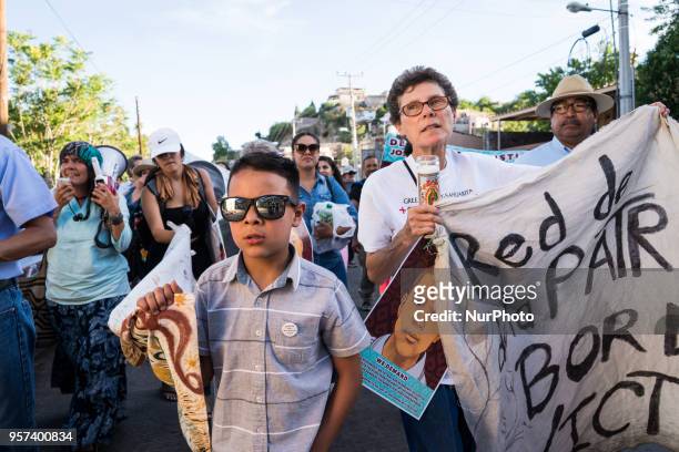 Demonstrators march through Nogales, Sonora, Mexico on May 10, 2018 demanding justice for Jose Antonio Elena Rodriguez, the Mexican teenager who was...