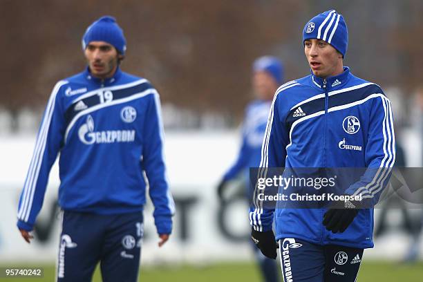 Halil Altintop and Besart Ibraimi attend the training session of FC Schalke at the training ground of the Veltins Arena on January 13, 2010 in...