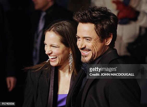 Actor Robert Downey Jr, and his wife, US producer Susan Downey pose for photographers prior to the German premiere of the film Sherlock Holmes in...