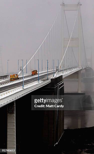 Gritting lorry sprays grit along the M48 motorway leading to the Severn Bridge which has been closed due to adverse weather on January 13, 2010 near...