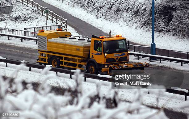 Gritting lorry sprays grit along the M48 motorway leading to the Severn Bridge which has been closed due to adverse weather on January 13, 2010 near...