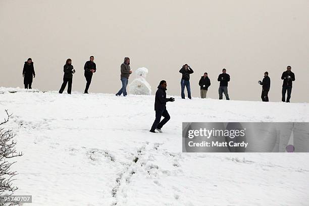 Office workers host a impromptu snow ball fight outside their offices close to the Severn Bridge which has been closed due to adverse weather on...