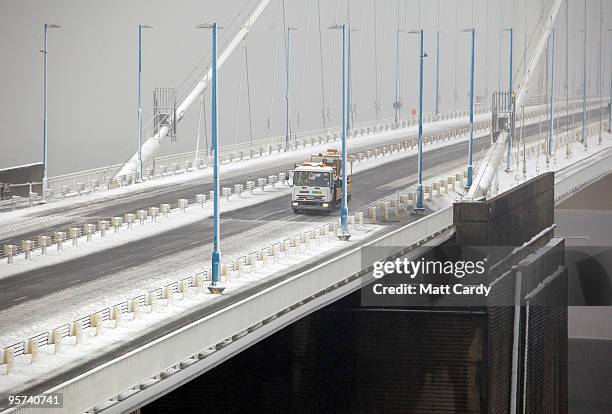 Highways agency lorry drives along the M48 motorway leading from the Severn Bridge which has been closed due to adverse weather on January 13, 2010...